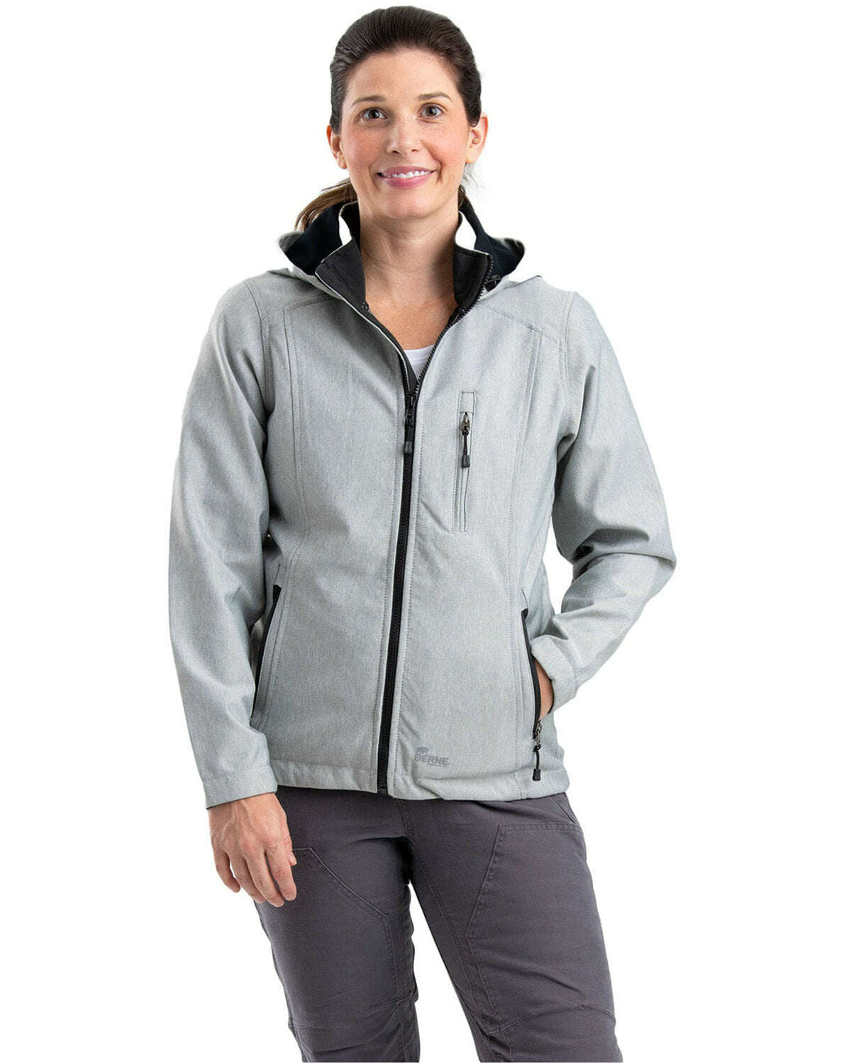 Woman wearing a Berne Ladies Hooded Softshell Jacket WJS301 in gray