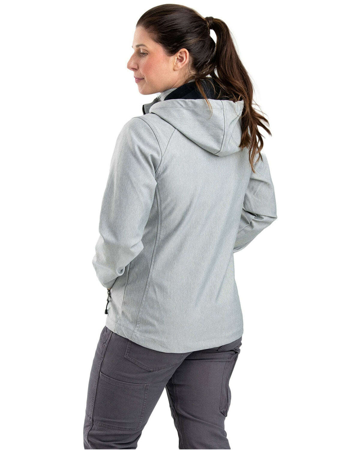 Woman wearing Berne Ladies Hooded Softshell Jacket WJS301 in gray for outdoor activities