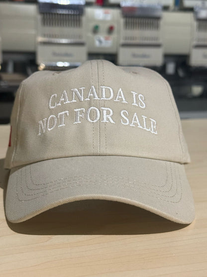 Beige Canada is Not For Sale Hat with white embroidery, ideal for custom apparel and sale hats