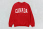Red crewneck sweatshirt with CANADA lettering, ideal for custom apparel and heavy blend wear