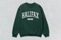 Green Halifax sweatshirt showcasing custom apparel and screen printing on unisex heavy blend crewneck