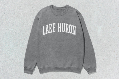Gray crewneck sweatshirt with Lake Huron text, ideal for custom apparel and lake enthusiasts