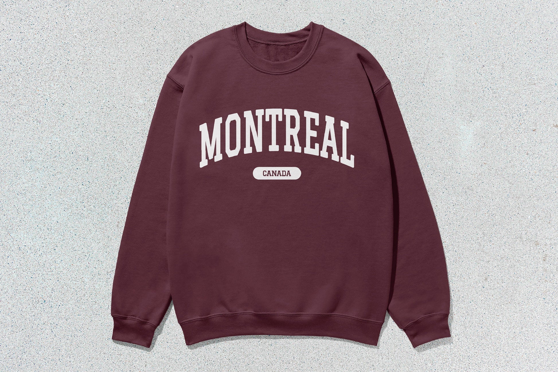 Maroon Montreal crewneck sweatshirt with Montreal Canada text in heavy blend fabric for custom apparel