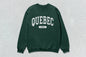Green Quebec unisex heavy crewneck sweatshirt with Quebec Canada text and heavy blend fabric